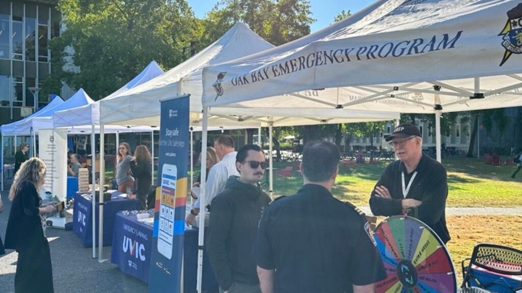 A line up of tents from emergency services set up on the lawn at the University of Victoria for the emergency preparedness fair.